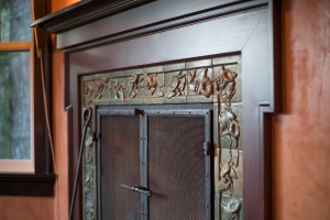 Craftsman morning glory tile fireplace surround